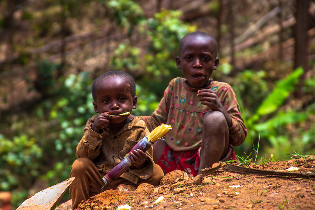 richard with alex eating a sugar cane